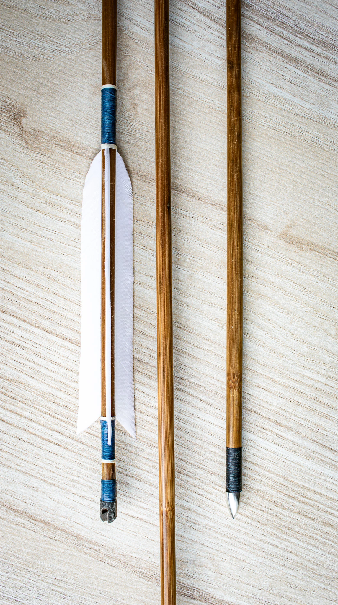 handmade wooden arrows with natural feathers