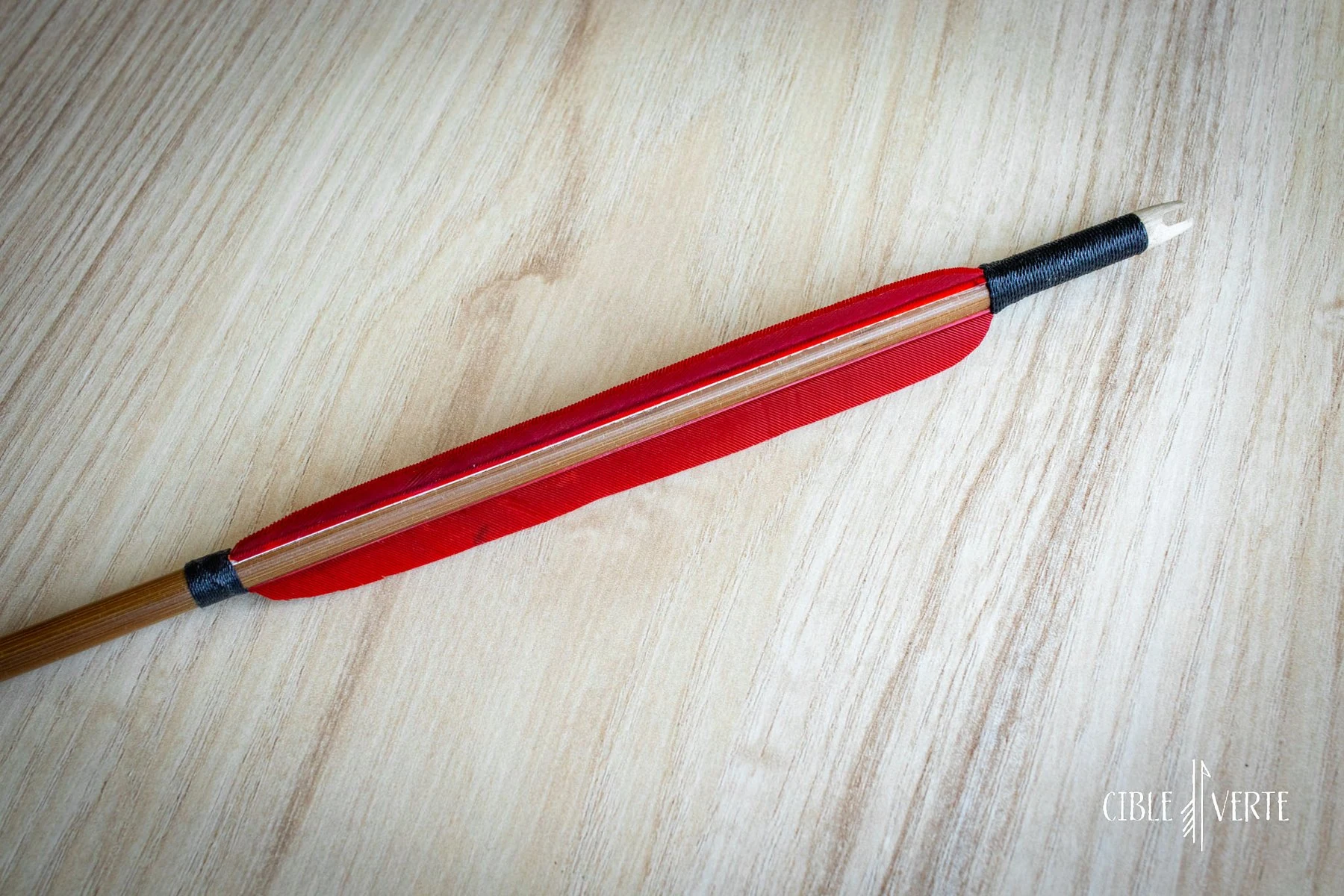 bamboo arrow with natural feathers