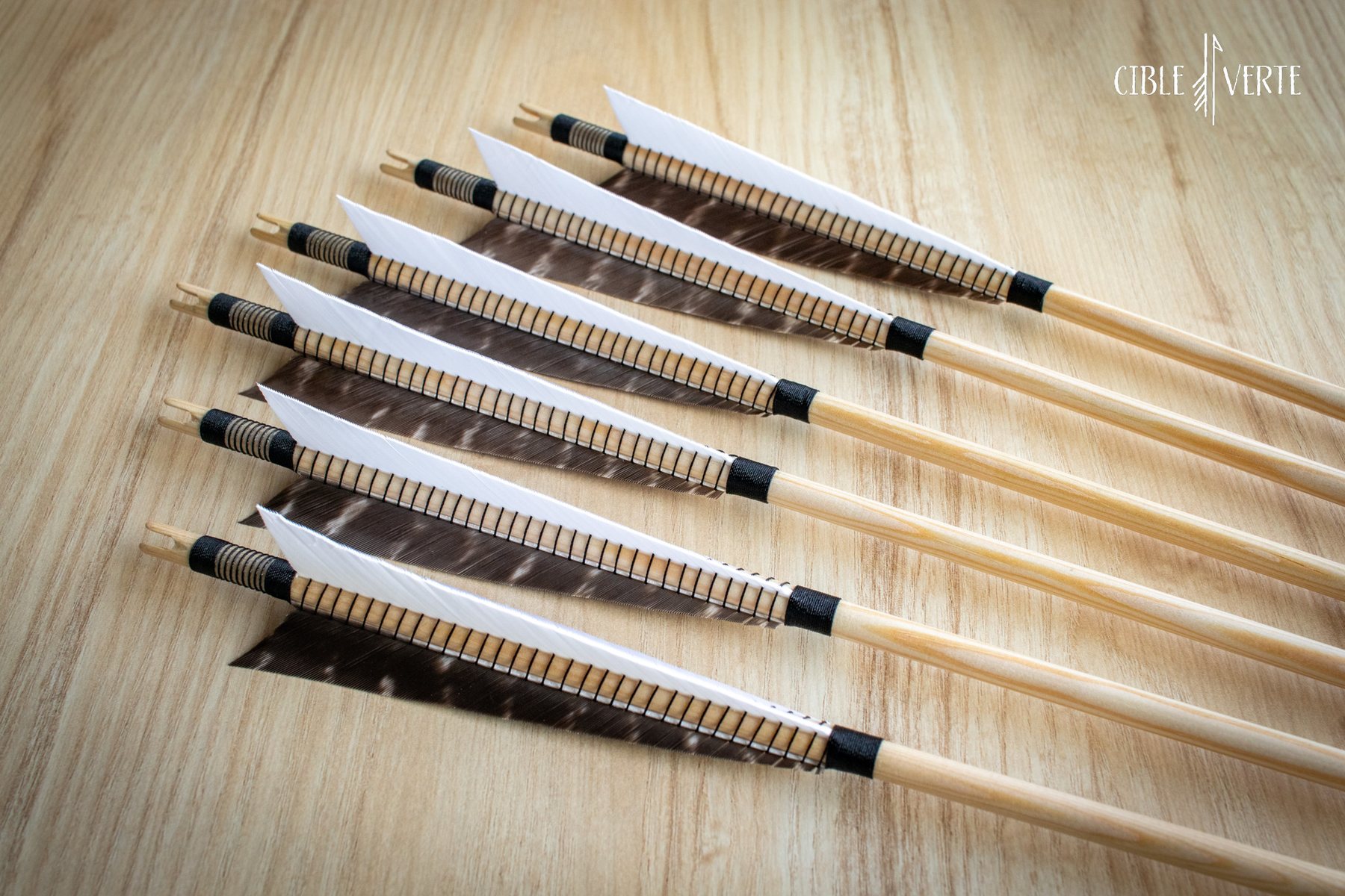 handmade wooden arrows with natural feathers
